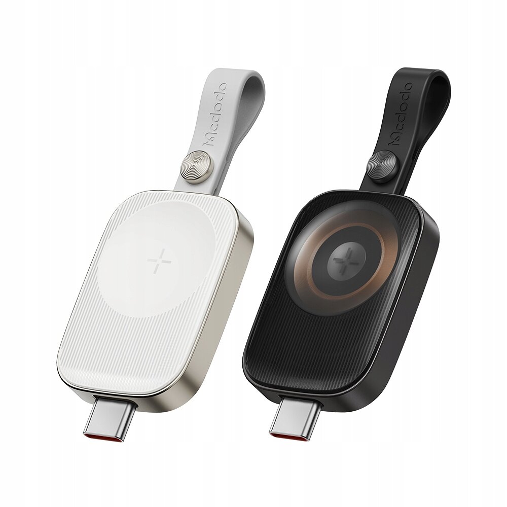 Dwa urządzenia do ładowania indukcyjnego z portem USB-C, jedno w kolorze białym, drugie czarnym, z logo \'mcdodo\' na pasku. Oba mają okrągły wzór na powierzchni ładowania.