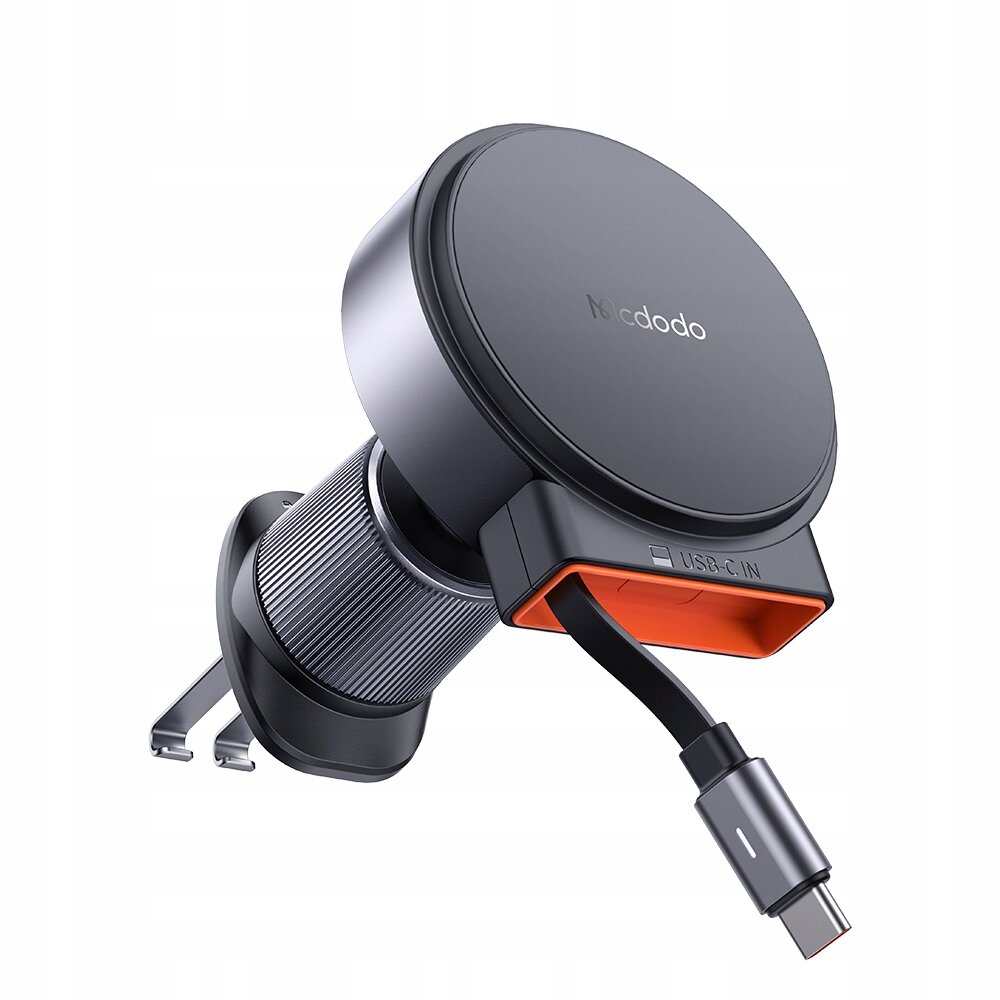 Na obrazie widoczny jest czarny uchwyt samochodowy na telefon z funkcją ładowania indukcyjnego, z logo \'Mcdodo\'. Uchwyt posiada port USB-C oznaczony jako \'USB-C IN\'.