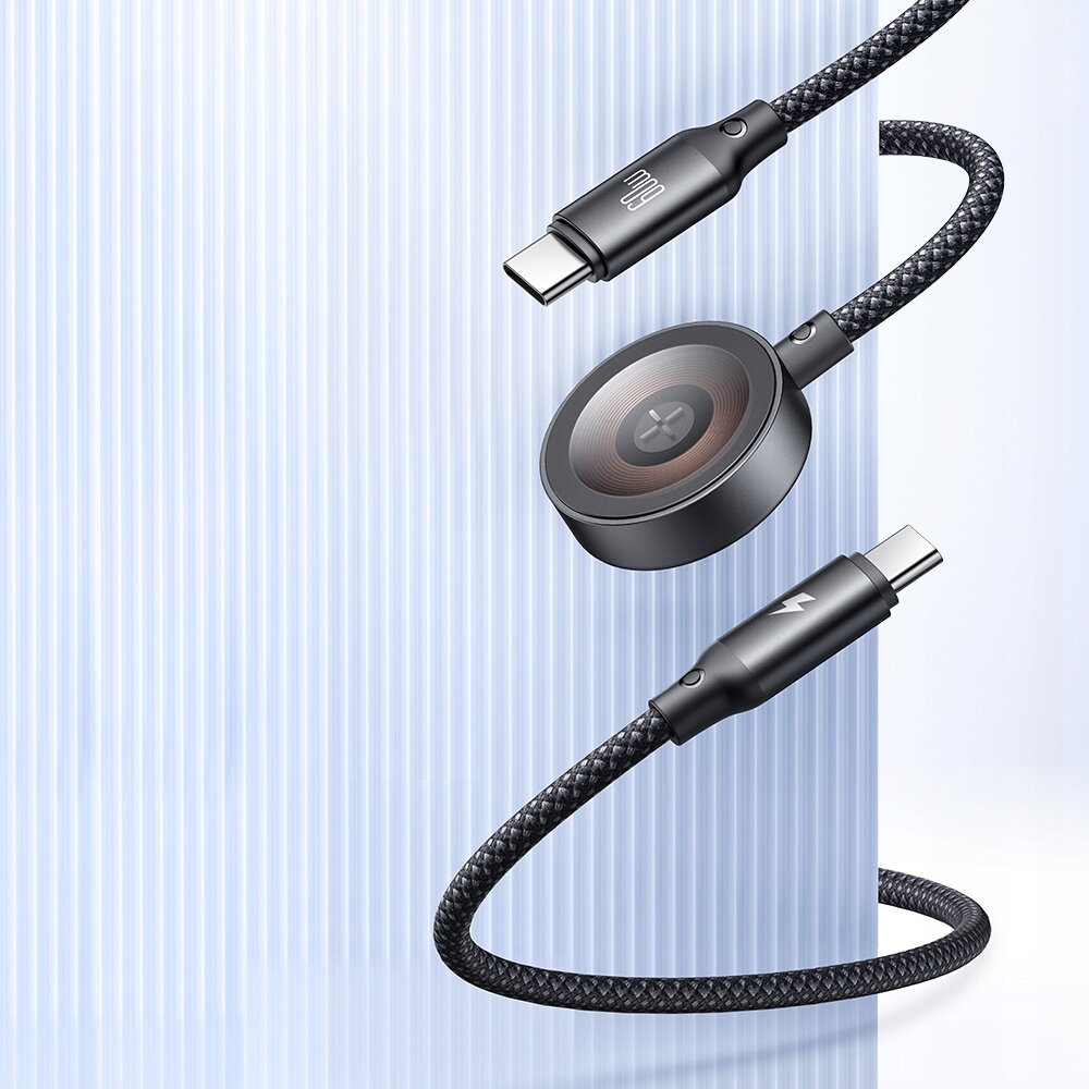 Na obrazie widoczny jest czarny kabel z dwoma złączami USB-C oraz okrągłą ładowarką indukcyjną. Kabel ma plecioną strukturę, a na złączach znajdują się symbole: jeden z logo \'Mcdodo\', drugi z symbolem błyskawicy.