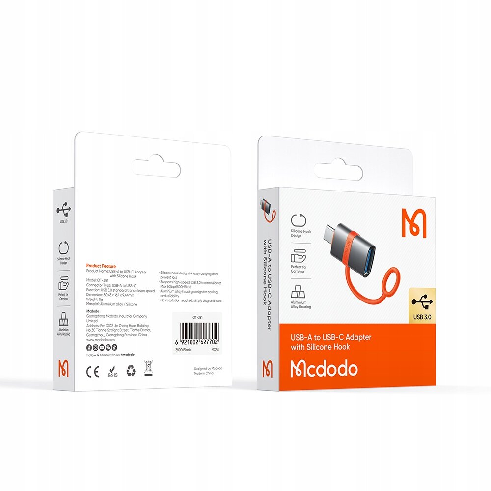 Opakowanie produktu Mcdodo Adapter Przejściówka USB-A 3.0 Do USB-C z silikonowym uchwytem. Widoczne są ikony przedstawiające funkcje adaptera oraz tekst \'USB-A to USB-C Adapter with Silicone Hook\'.