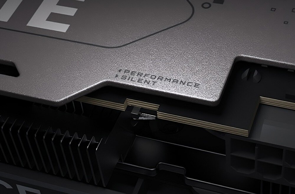 Karta graficzna GIGABYTE GeForce RTX 5060 Ti Gaming OC 16GB Zbliżenie na część plecków karty z małym przełącznikiem oznaczonym 'Performance' i 'Silent', funkcja Dual BIOS, tryby