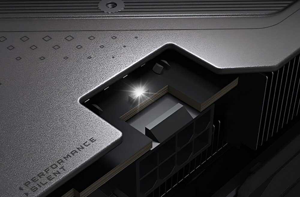 Karta graficzna GIGABYTE GeForce RTX 5060 Ti Gaming OC 16GB Fragment bocznej krawędzi z podświetlonym logo producenta i diodą RGB na wąskim świetlnym pasku, konstrukcja, komponenty, wskaźnik zasilania
