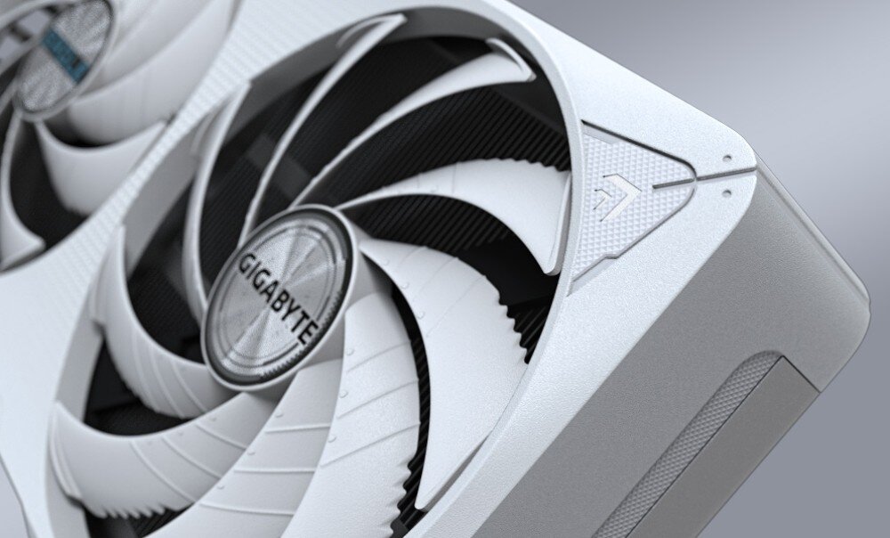 Karta graficzna GIGABYTE GeForce RTX 5060 Ti Eagle OC Ice 16GB Zbliżenie na narożnik karty graficznej, w centrum wentylator z logo 'GIGABYTE' i wyraźnie widoczne detale obudowy, wygląd, obudowa, materiały