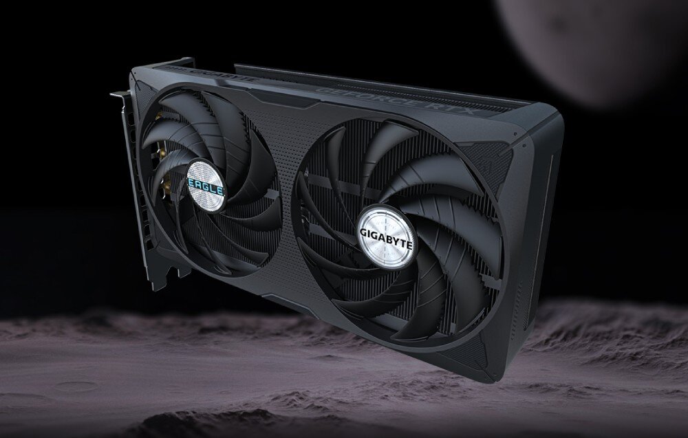 Karta graficzna GIGABYTE GeForce RTX 5060 Ti Eagle OC 16GB Ujęcie karty z dwóch dużych wentylatorów z logo 'Eagle' i 'Gigabyte', widocznej na tle ciemnego księżycowego krajobrazu, architektura, technologie, taktowanie