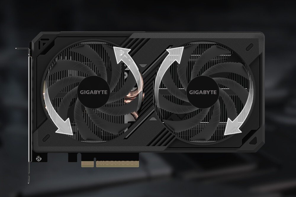 Karta graficzna GIGABYTE GeForce RTX 5060 Ti Windforce OC 16GB Widok z góry na kartę graficzną z zaznaczonym kierunkiem obrotu wentylatorów za pomocą białych strzałek, wentylatory, łopatki, żywotność