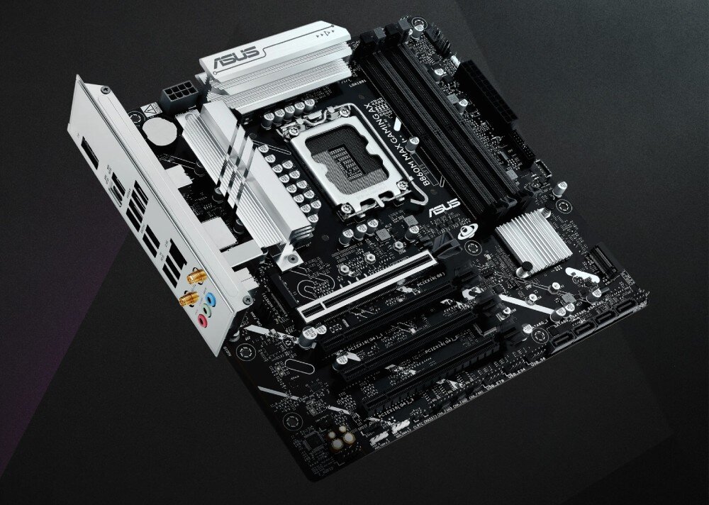 Komputer ASUS G700TF-09285K239W Płyta główna ASUS z jasnoszarymi radiatorami i czarnym laminatem, ukazana pod lekkim kątem na ciemnym tle, płyta główna, radiatory, kompatybilność