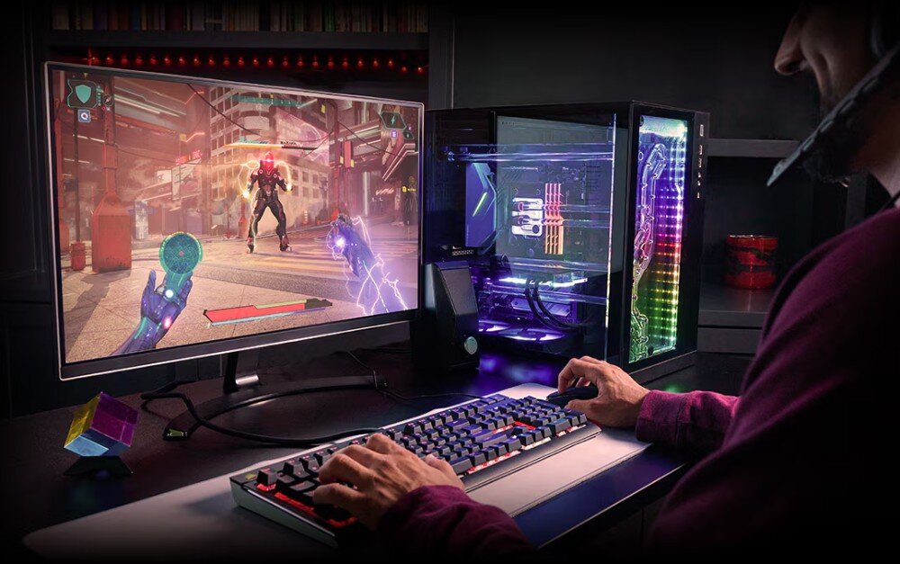 Procesor AMD Ryzen 9 9950X Osoba grająca w grę komputerową przy biurku z komputerem stacjonarnym wyposażonym w obudowę z podświetleniem RGB i przezroczystym panelem bocznym, układ graficzny, rozgrywka
