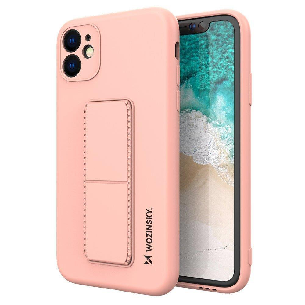 Różowe silikonowe etui z podstawką na telefon, z widocznym logo \'WOZINSKY\' na boku. Etui jest założone na telefon z wyświetlaczem pokazującym plażę i ocean.