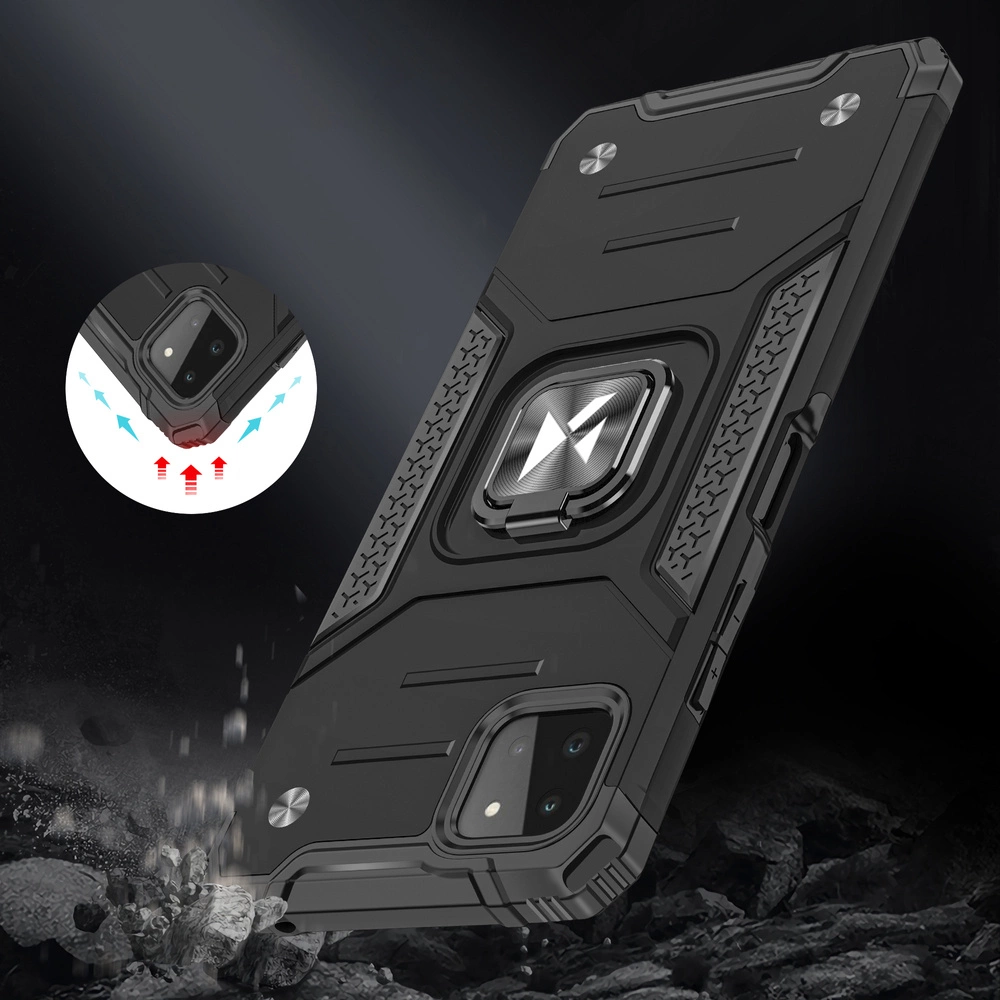 Czarne, pancerne etui na telefon z metalicznym uchwytem magnetycznym na środku. W tle widoczne są skały, a w okrągłym powiększeniu pokazano narożnik etui z oznaczeniami ochrony przed upadkiem.
