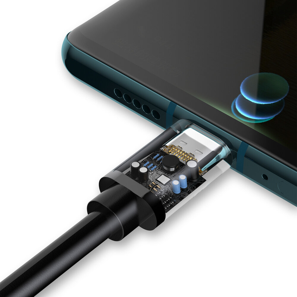 Obraz przedstawia czarny kabel USB typu C podłączony do urządzenia, z widocznym przezroczystym fragmentem ukazującym wewnętrzne komponenty elektroniczne. Urządzenie ma ciemny ekran i metaliczną obudowę.
