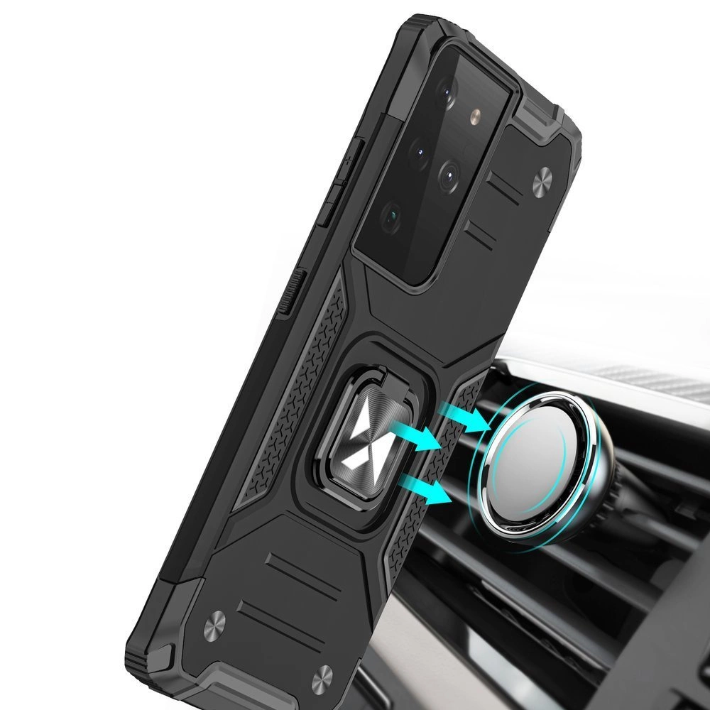 Czarne etui ochronne na telefon z wbudowanym magnetycznym uchwytem, pokazane w pobliżu okrągłego uchwytu magnetycznego w samochodzie. Etui ma wyraźne linie i teksturę, a na tylnej części widoczne są wycięcia na aparat.