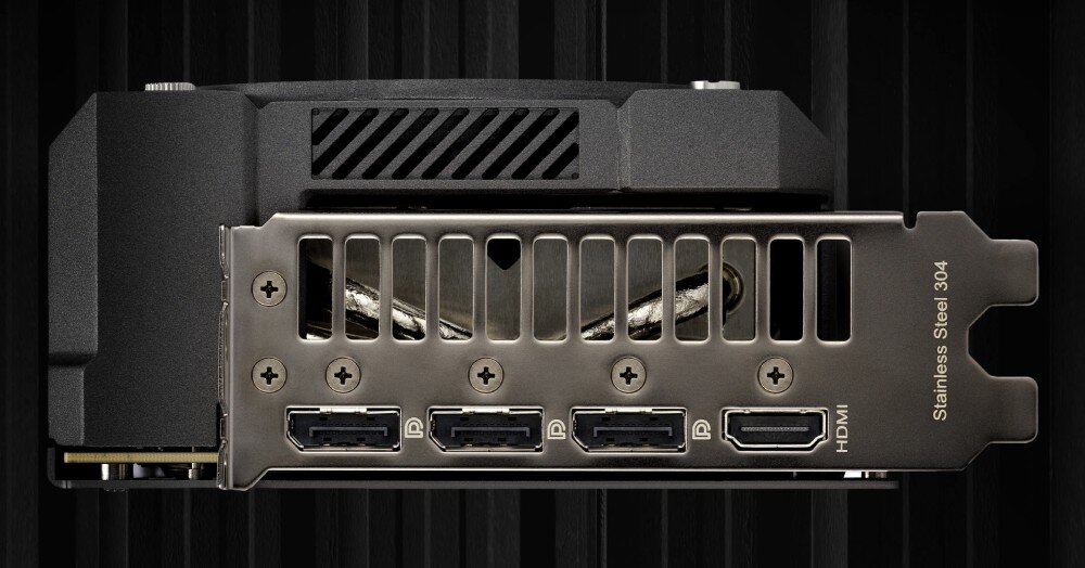 Karta graficzna ASUS TUF Gaming GeForce RTX 5060 Ti OC Edition 16GB Zbliżenie na porty wyjściowe karty graficznej: trzy DisplayPort i jeden HDMI na czarnym, prążkowanym tle