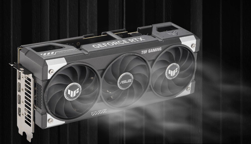 Karta graficzna ASUS TUF Gaming GeForce RTX 5060 Ti OC Edition 16GB Karta graficzna z widocznym przepływem powietrza z wentylatorów na czarnym, prążkowanym tle