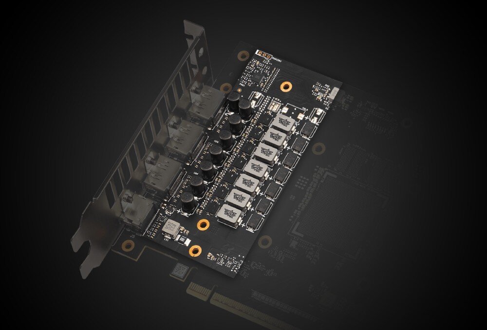 Karta graficzna ASUS TUF Gaming GeForce RTX 5060 Ti OC Edition 16GB Zbliżenie na komponenty zasilające karty graficznej na rozmazanym, ciemnym tle