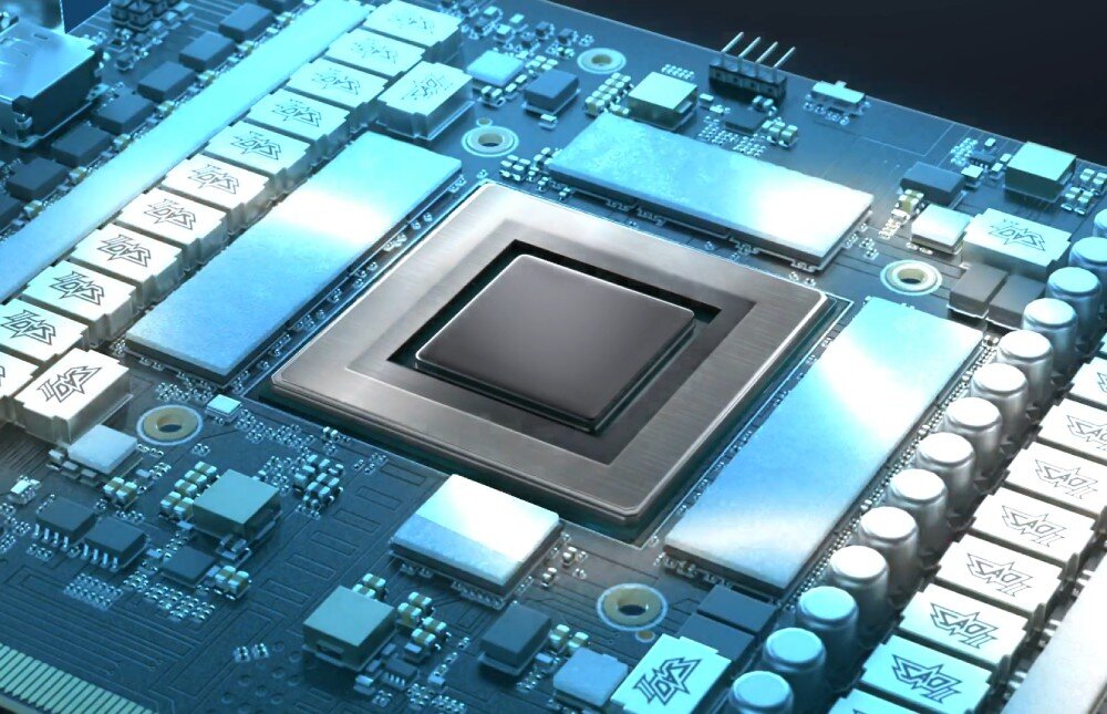 Karta graficzna ASUS TUF Gaming GeForce RTX 5060 Ti OC Edition 16GB Zbliżenie na procesor graficzny i otaczające go komponenty na płytce drukowanej w niebieskim oświetleniu