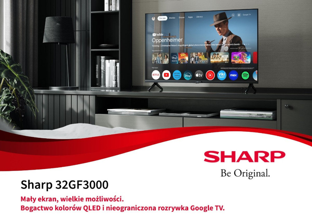 Telewizor wyświetla ekran główny z aplikacjami, w tym YouTube z filmem \'Oppenheimer\'. Na dole widnieje napis: \'Sharp 32GF3000 Mały ekran, wielkie możliwości. Bogactwo kolorów QLED i nieograniczona rozrywka Google TV.\' oraz logo SHARP z hasłem \'Be Original.\'