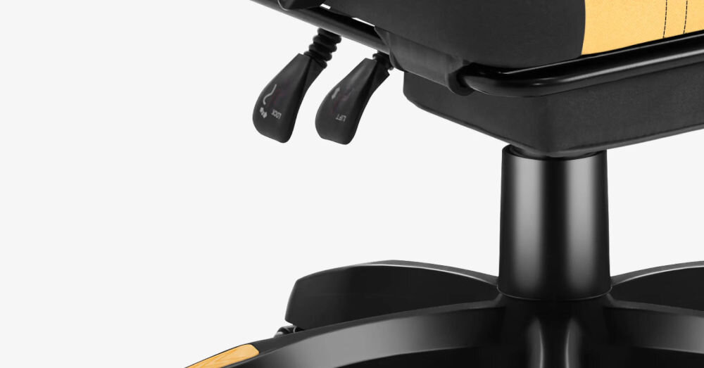 Fotel HUZARO Force 3.7 Żółto-czarny zbliżenie na siłownik gazowy klasy 3 normy bezpieczeństwa BIFMA bezstopniowa regulacja wysokości płynność udźwig do 140 kg solidność konstrukcji