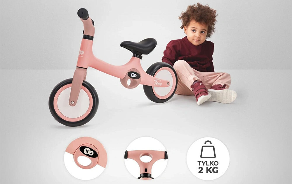 Rowerek biegowy KINDERKRAFT Tove Różowy rowerek w kolorze różowym obrazki przedstawiające uchwyty obok siedzi dziecko wygoda rodziców dwa ergonomiczne uchwyty chwycenie za uchwyty komfortowe niesienie pojazdu ułatwia przemieszczanie się bez zbędnych utrudnień wygodny dla dzieci funkcjonalny dla ich opiekunów 