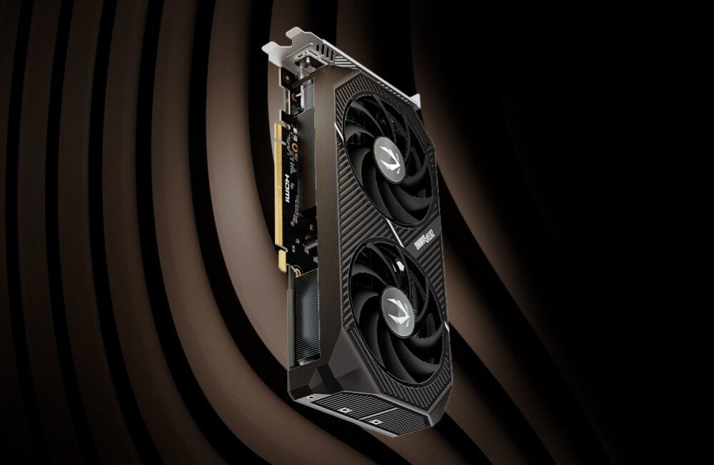 Karta graficzna ZOTAC Gaming GeForce RTX 5060 Ti Twin Edge 8GB karta graficzna z dwoma wentylatorami ustawiona pionowo na tle ciemnych koncentrycznych pasów