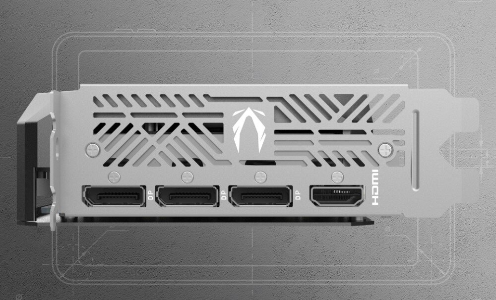 Karta graficzna ZOTAC Gaming GeForce RTX 5060 Ti Twin Edge OC 8GB Tylny panel wyjść wideo karty graficznej. Widać trzy porty DisplayPort i jeden HDMI, a także perforacje w osłonie w kształcie geometrycznych wzorów, porty, wyjścia, monitory, rozdzielczość