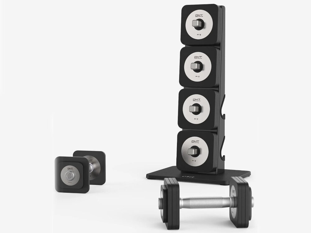 Na obrazie widoczny jest zestaw hantli z czarnymi i srebrnymi elementami oraz stojak na hantle. Na hantlach widnieje logo \'S-LINE\'.