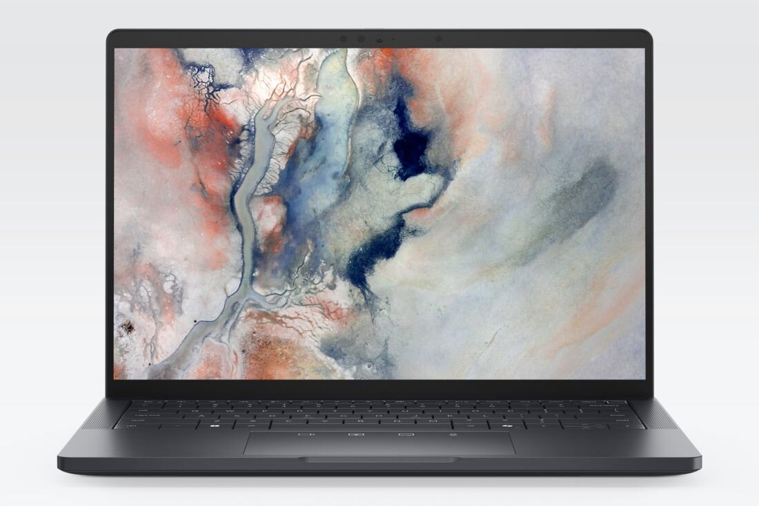 Laptop Dell Pro Premium z ekranem OLED wyświetla abstrakcyjną grafikę w wysokiej rozdzielczości na jasnym tle podczas pracy kreatywnej.