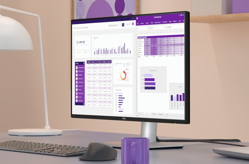 Monitor DELL P2425D Monitor stojący na biurku obok lampy, myszki i klawiatury, wyświetlający wykresy oraz dane finansowe