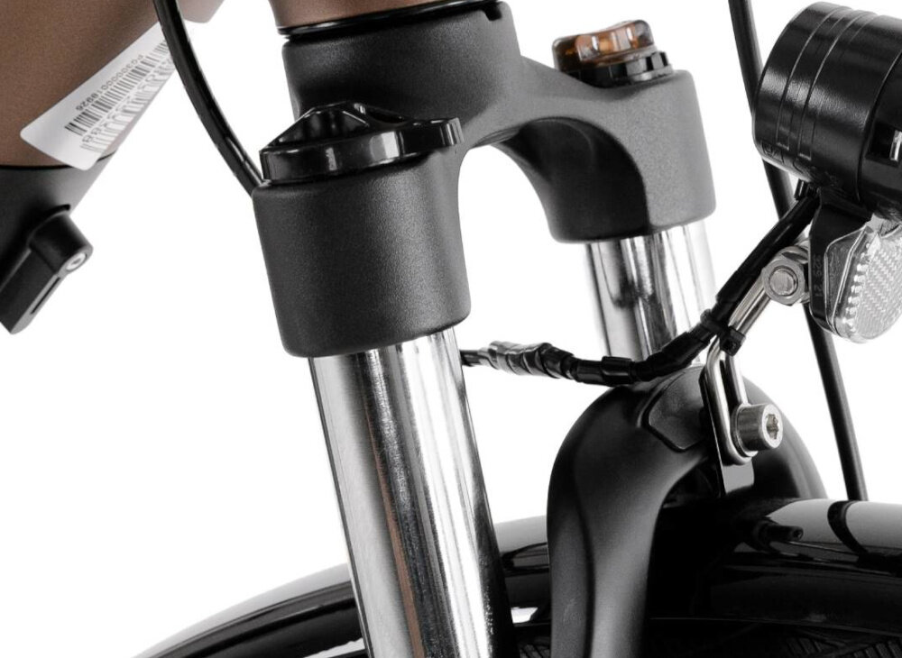 Rower elektryczny PROECO Wave AN 1.0 M17 28 cali Brązowy zbliżenie na amortyzator białe tło rower typu hardtail przedni amortyzator marki MODE typu MD-689 skuteczne tłumienie drgań komfort i stabilność prowadzenia prosta konstrukcja wygoda bezpieczeństwo