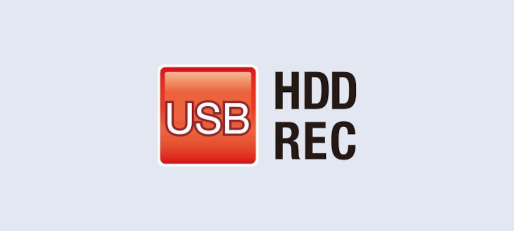 Obraz przedstawia czerwony kwadrat z białym napisem \'USB\' oraz czarny napis \'HDD REC\' na jasnym tle.