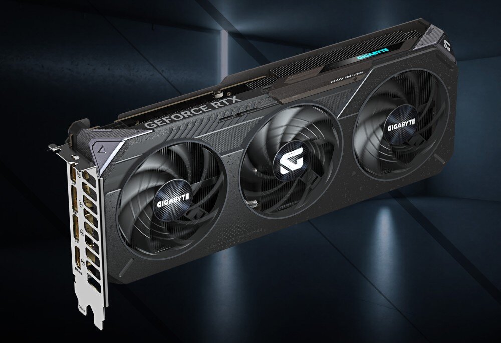 Karta graficzna GIGABYTE GeForce RTX 5060 Gaming OC 8GB Ujęcie karty pod kątem, widoczna obudowa z teksturą mechanicznego pancerza i metalowy panel z portami wyjściowymi, układ graficzny, rdzenie CUDA, taktowanie, technologie, pamięć