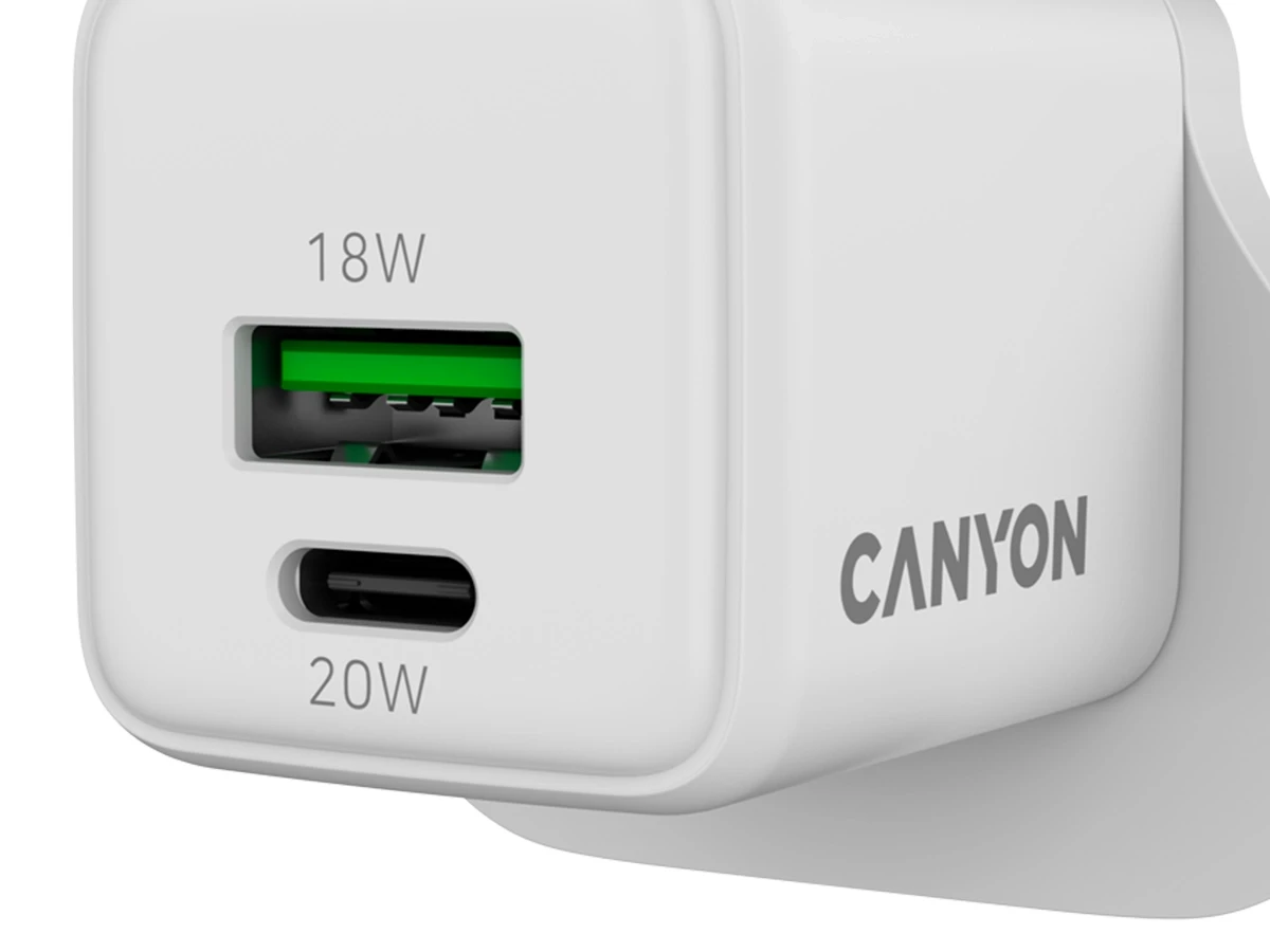 Biała ładowarka sieciowa z dwoma portami: USB oznaczonym \'18W\' i USB-C oznaczonym \'20W\'. Na obudowie widoczne jest logo \'CANYON\'.