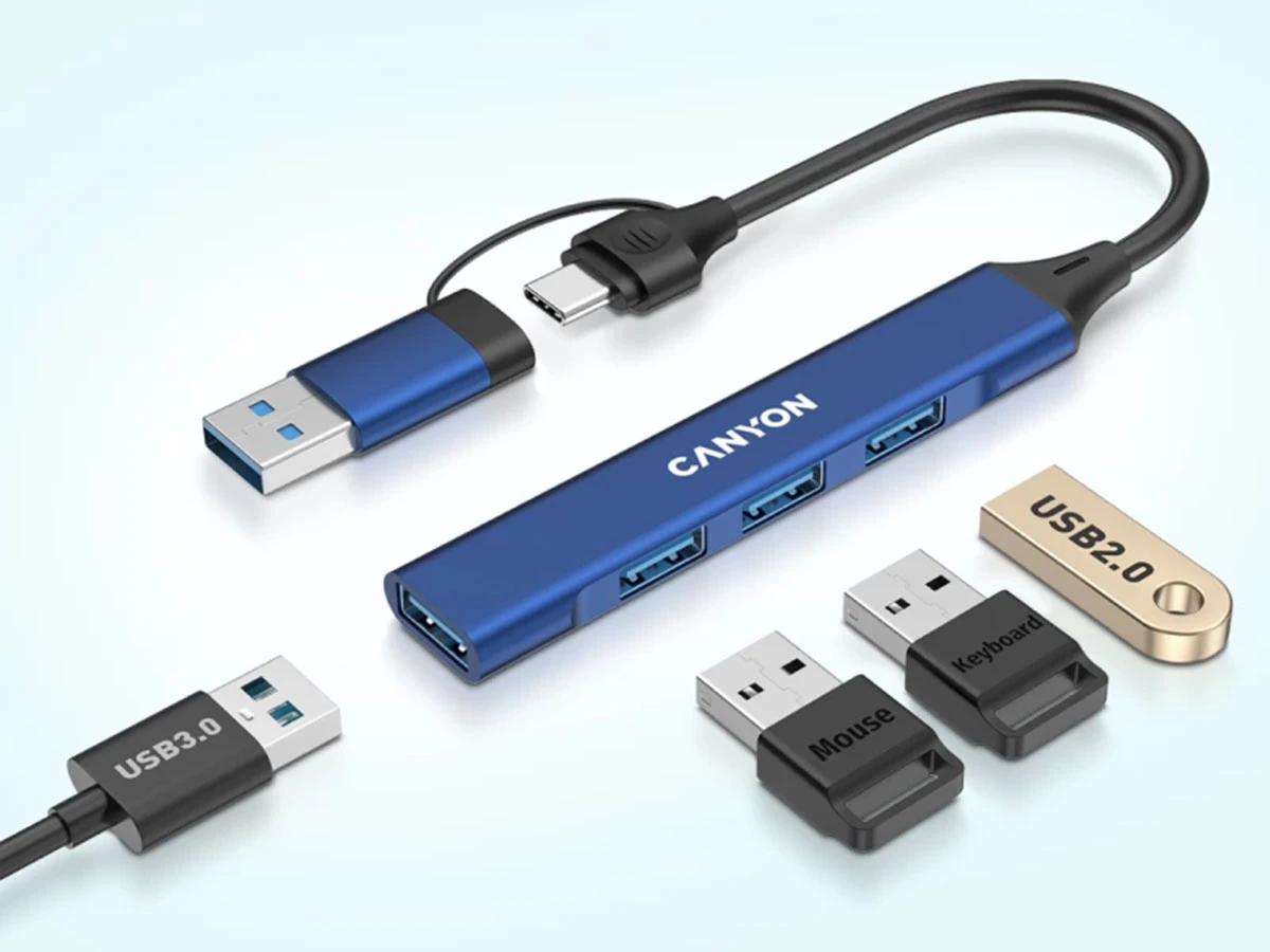 Na obrazie widoczny jest niebieski hub USB z napisem \'CANYON\', posiadający kilka portów USB. Obok znajdują się różne wtyczki USB oznaczone jako \'USB3.0\', \'USB2.0\', \'Mouse\' i \'Keyboard\'.