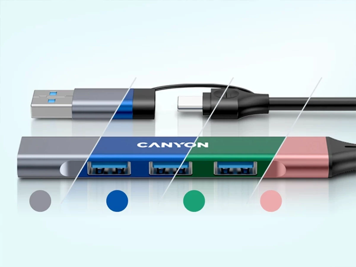Obraz przedstawia hub USB z czterema portami, oznaczony logo \'CANYON\'. Hub ma różne kolory: szary, niebieski, zielony i różowy.