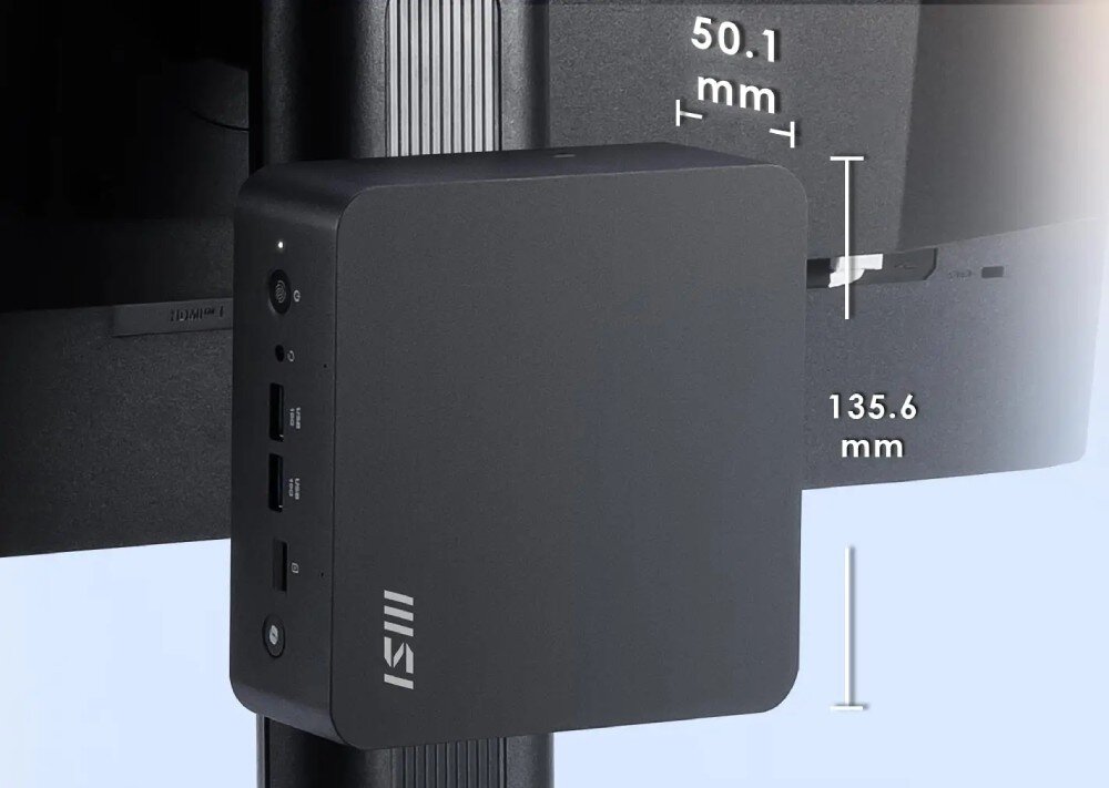 Komputer MSI Cubi NUC AI+ 2MG-007EU Niewielki komputer o wymiarach 135,6 x 50,1 mm zamontowany jest z tyłu monitora na uchwycie VESA, obok widoczne są porty i oznaczenia złączy, cechy, zalety, obudowa