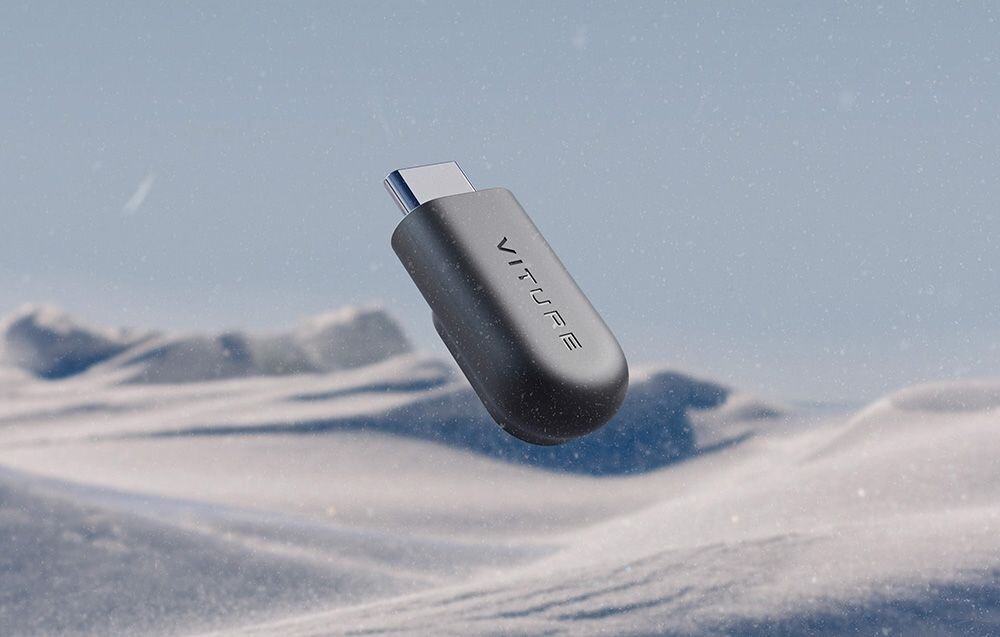 Złącze magnetyczne Viture do adaptera USB-C Czarny adapter Viture USB-C na tle gór i śniegu