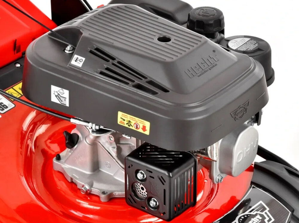 Kosiarka spalinowa HECHT 546 zbliżenie na silnik silnik marki HECHT technologia czterosuwowa konstrukcja górnozaworowa OHV pojemność 150 cm3 praca z prędkością do 3000 obr/min maksymalny moment obrotowy do 7,8 Nm moc 2,7 kW