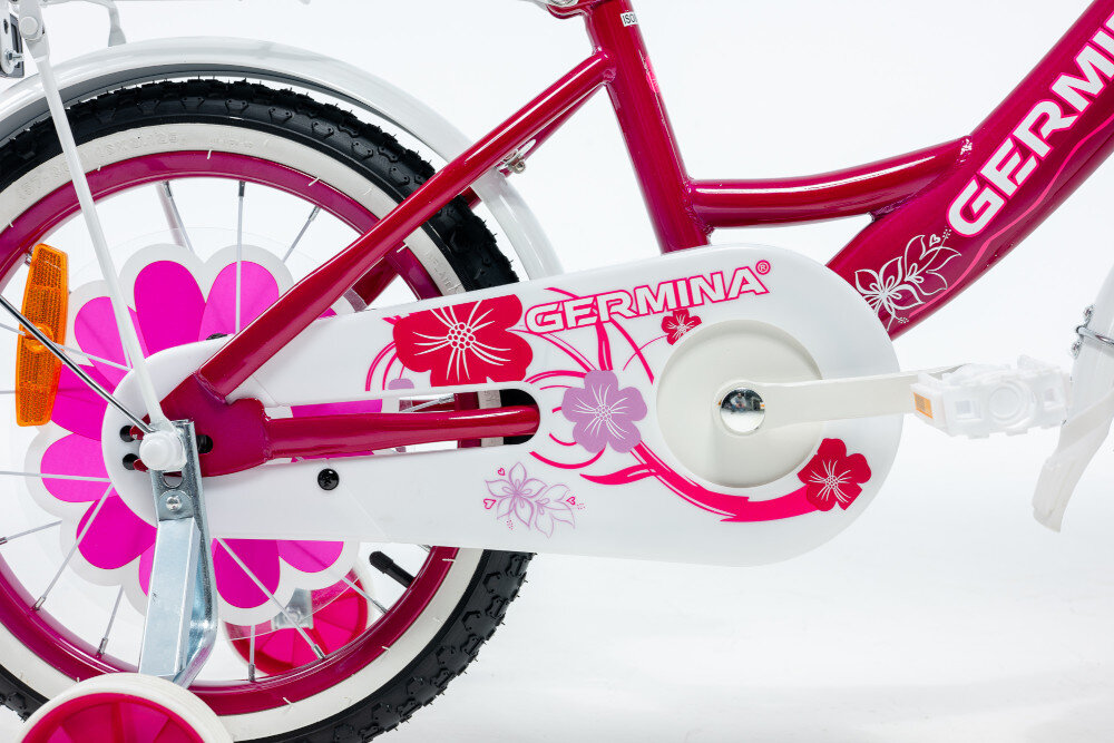 Rower dziecięcy GERMINA BMX 16 cali dla dziewczynki Ciemnoróżowy zbliżenie na osłonę łańcucha boczne kółka asekurują dziecko w początkowej fazie nauki boczne kółka można łatwo usunąć osłona łańcucha grafika w kwiatki zabezpiecza łańcuch przed brudem