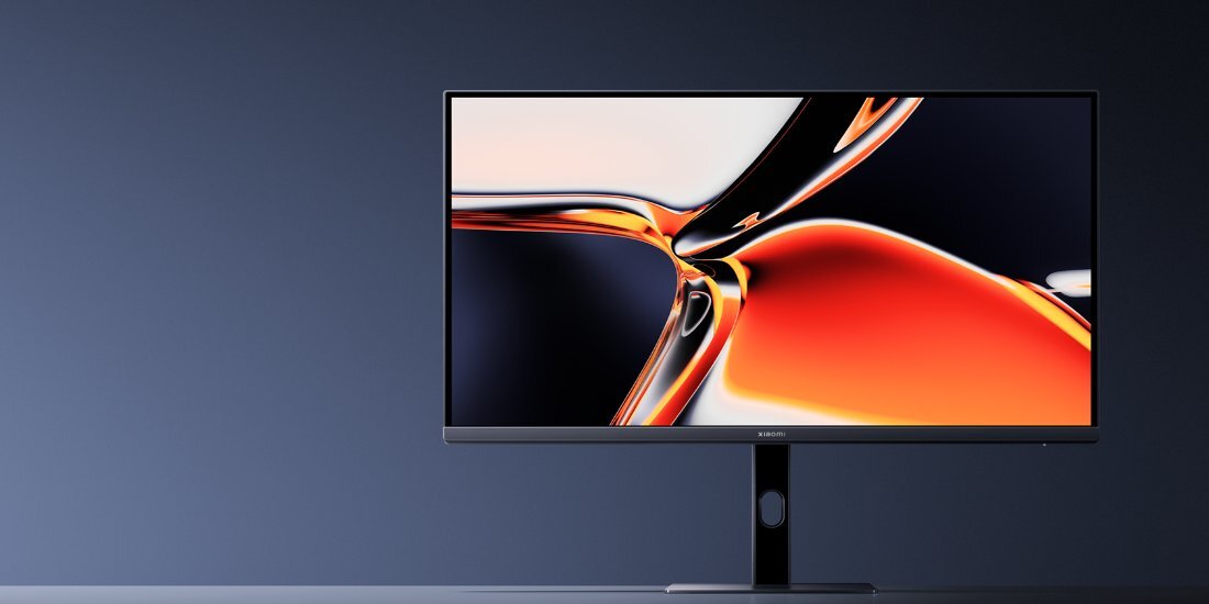 Monitor XIAOMI na szarawym tle.
