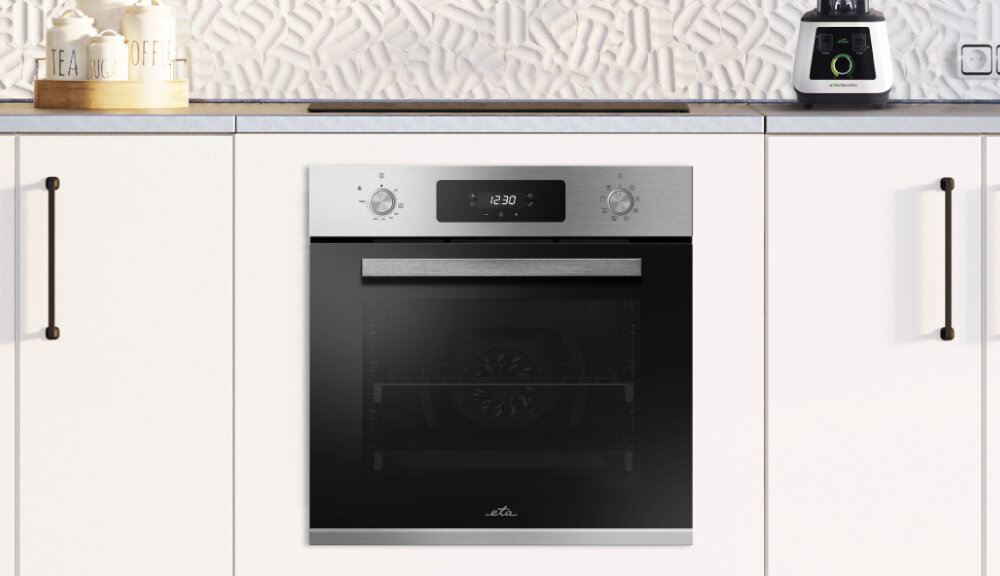 Piekarnik ETA Comfort 178790000 lifestyle zabudowa białe szafki kuchnia dekoracje akcesoria kuchenne blat elegancki design praktyczne funkcje gotowanie pojemność 70 litrów kuchnia gospodarstwo domowe kulinarne pasje