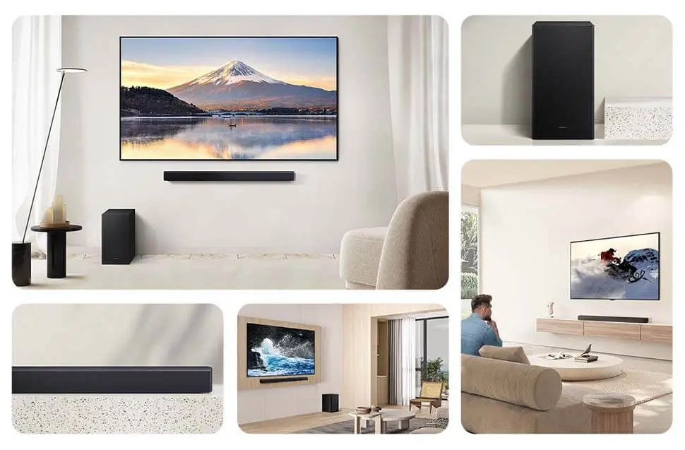 Na obrazie widać nowoczesne wnętrze z telewizorem na ścianie, pod którym znajduje się czarny soundbar. Obok telewizora stoi czarny subwoofer, a w pomieszczeniu znajdują się jasne meble i dekoracje.