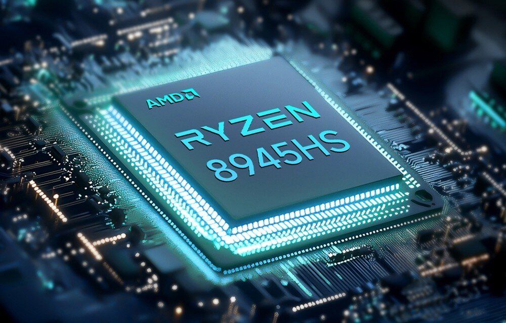 Komputer GMKTEC NucBox K11 Grafika przedstawiająca procesor z napisem 'AMD Ryzen 8945HS' umieszczony na tle układu scalonego, procesor, rdzenie, wątki