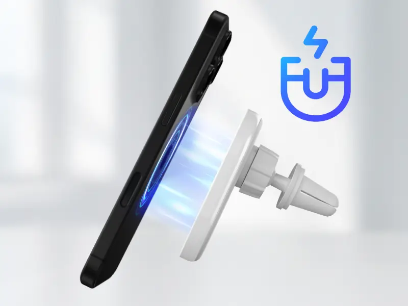 Obraz przedstawia czarny smartfon przyciągany do białej, magnetycznej ładowarki samochodowej. Obok znajduje się niebieska ikona z symbolem magnesu i błyskawicy.