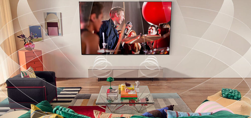 Telewizor LG 55QNED70A6A dźwięk przestrzenny 9.1.2, telewizor zawieszony na ścianie z którego wydobywa się dźwięk