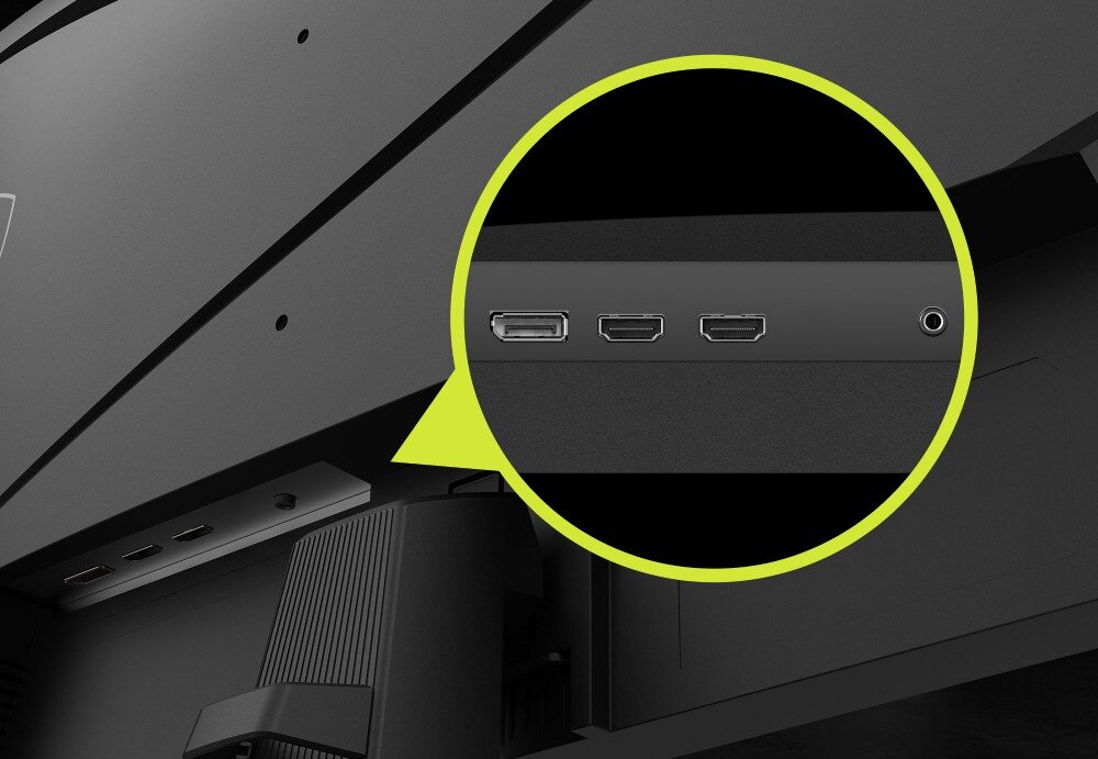 Monitor MSI Mag 274QF Zbliżenie na porty z tyłu obudowy w żółtym okręgu, widoczne złącza DisplayPort, dwa wejścia HDMI oraz gniazdo słuchawkowe