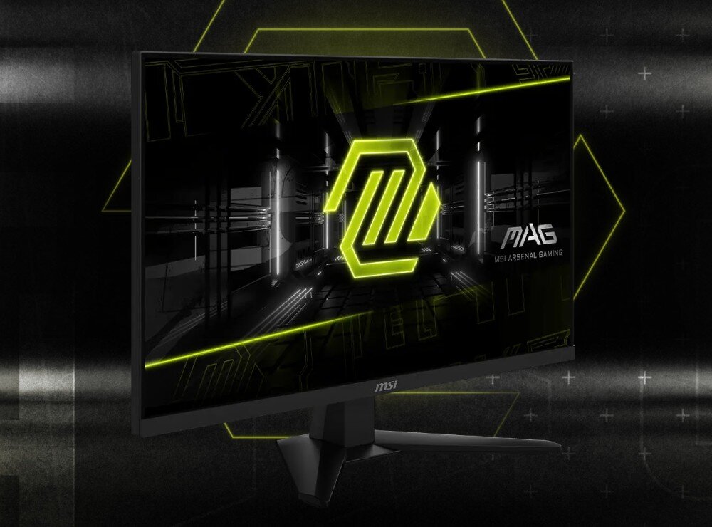 Monitor MSI Mag 274QF Monitor ukazany z dolnej perspektywy na ciemnym tle, widoczna podstawa oraz ekran z logotypem i zielonymi liniami