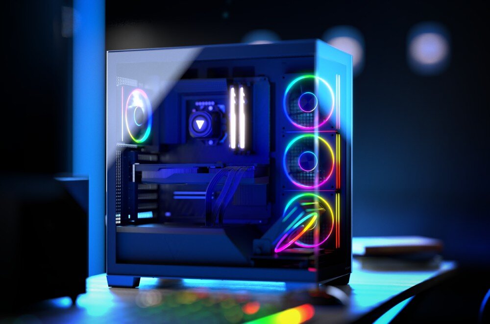 Obudowa MODECOM Volcano Stellar ARGB 5F Midi Gotowy zestaw komputerowy z podświetleniem ustawiony na biurku w ciemnym pomieszczeniu