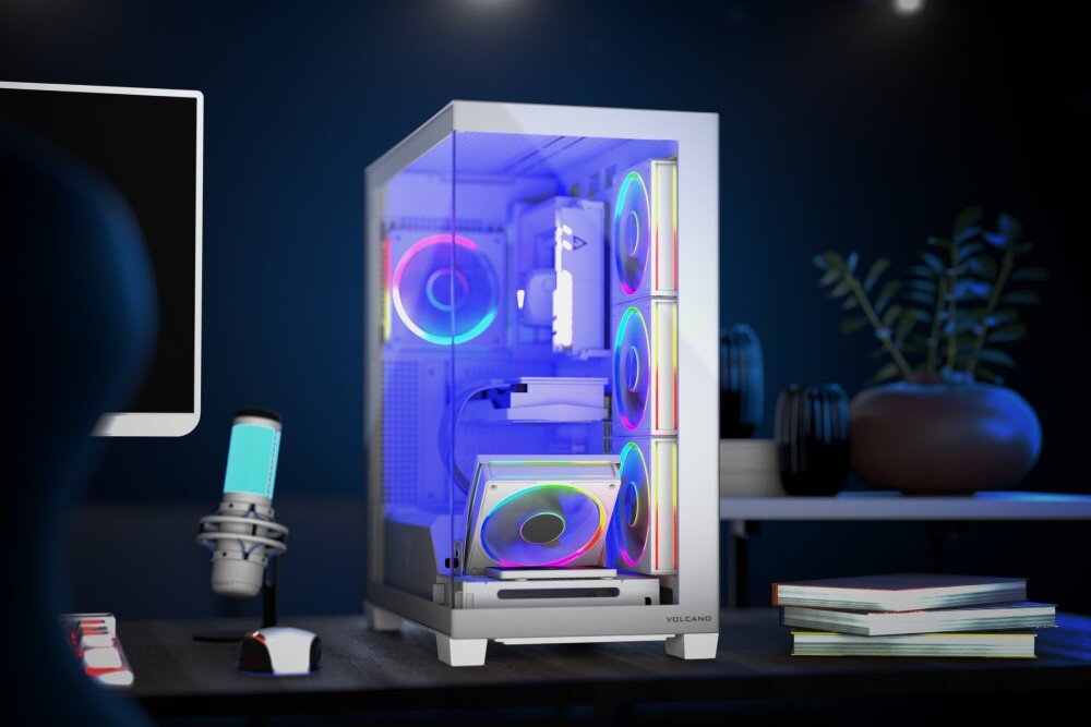 Obudowa MODECOM Volcano Stellar ARGB 5F Midi Gotowy zestaw komputerowy z podświetleniem ustawiony na biurku w ciemnym pomieszczeniu