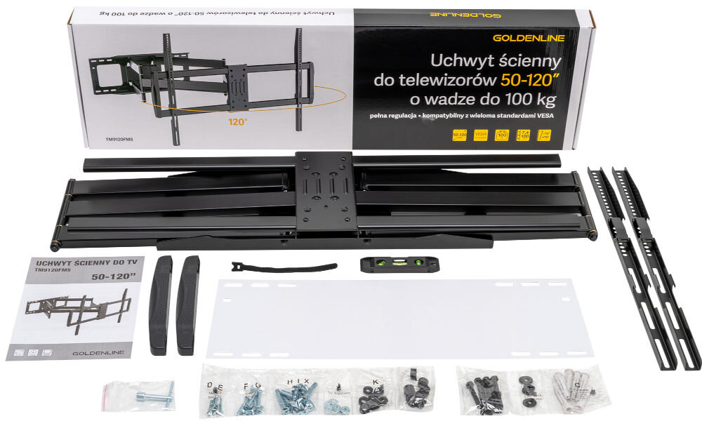 Na obrazie znajduje się zestaw montażowy do telewizorów, w tym uchwyt ścienny, poziomica, instrukcja oraz różne śruby i elementy montażowe. Na opakowaniu widnieje napis: \'GOLDENLINE Uchwyt ścienny do telewizorów 50-120\