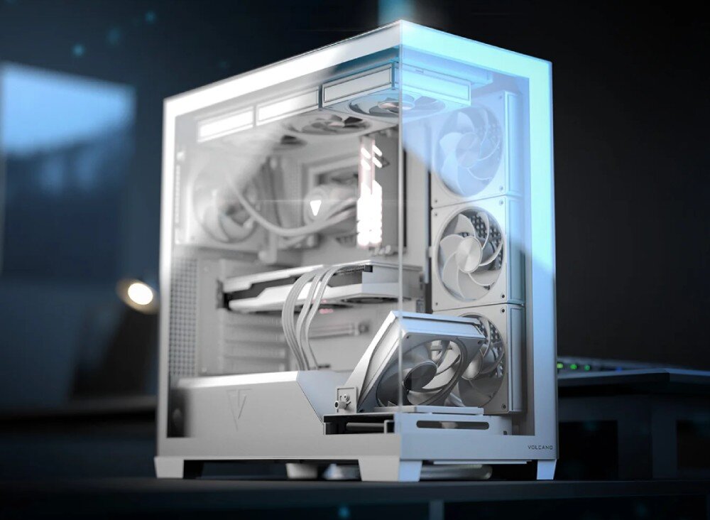 Obudowa MODECOM Volcano Stellar Midi Gotowy zestaw komputerowy z podświetleniem ustawiony na biurku w ciemnym pomieszczeniu