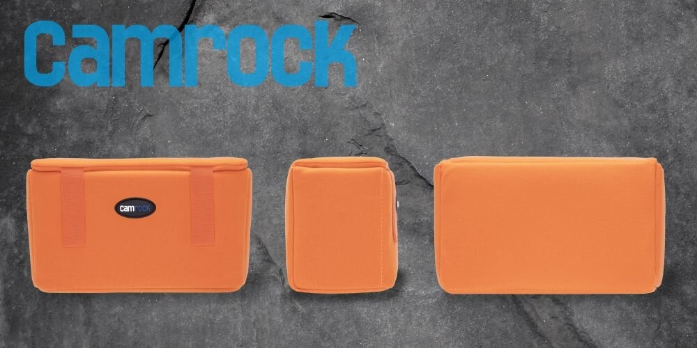 Na szarym tle widoczne są trzy pomarańczowe wkłady fotograficzne o różnych rozmiarach. W lewym górnym rogu znajduje się niebieskie logo \'Camrock\'.